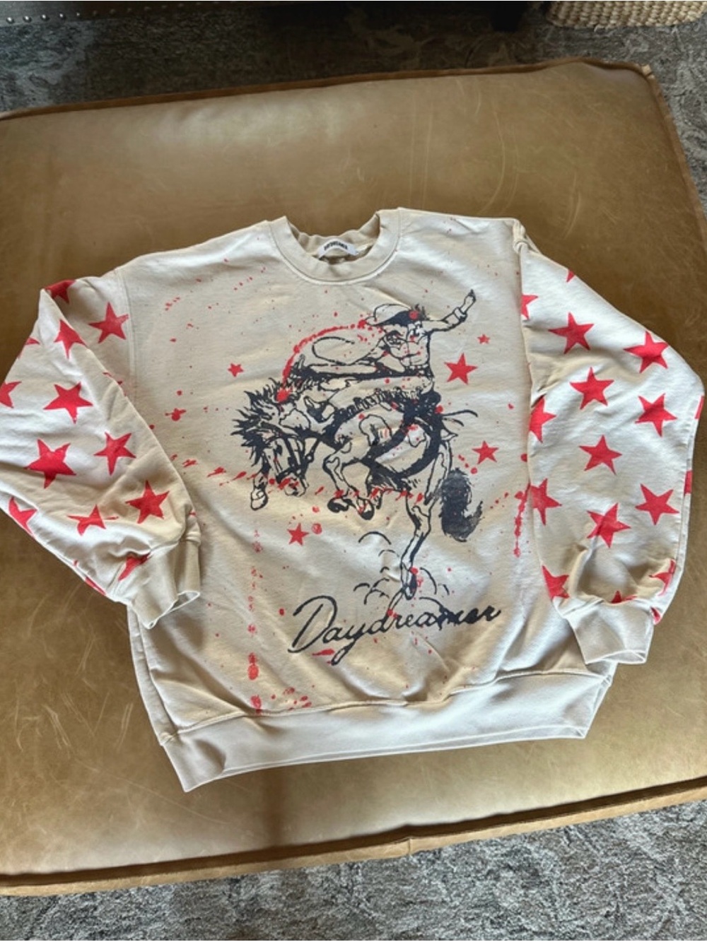 Daydreamer Cream Crewneck with Red Star Sleeves and Navy Rodeo Graphic